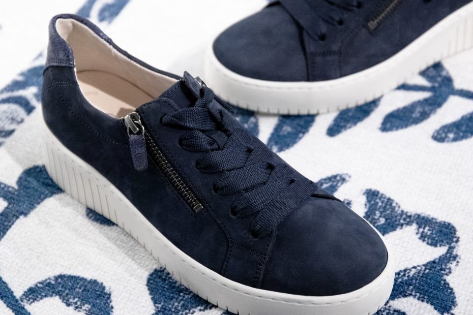 Gabor wold blue nubuck shoes in blue are set on a blue patterned rug.