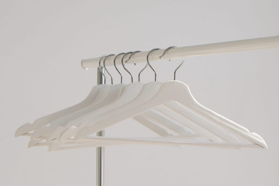 Empty hangers hung on a railing
