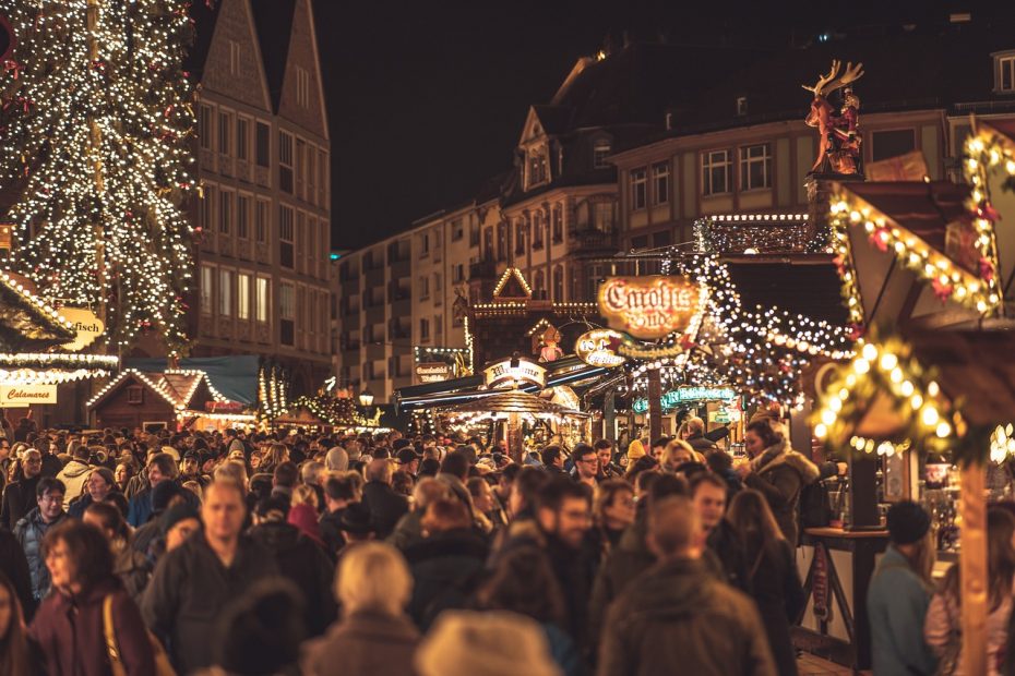 A crowd of people gathered at a Christmas Market