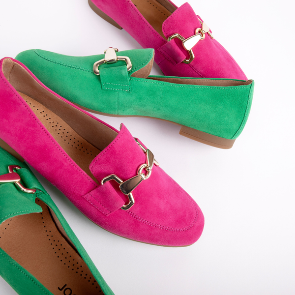 A pair of green shoes and a pair of pink shoes
