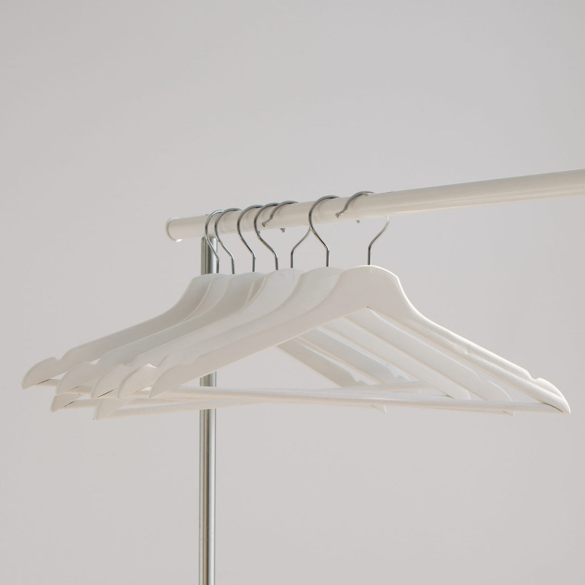 Empty hangers hung on a railing