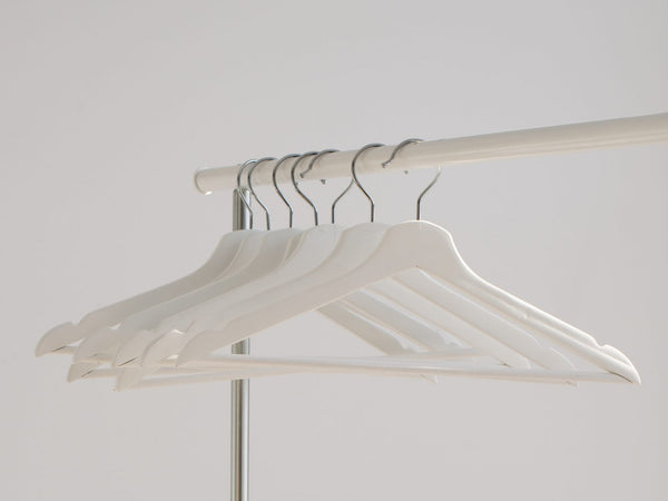 Empty hangers hung on a railing
