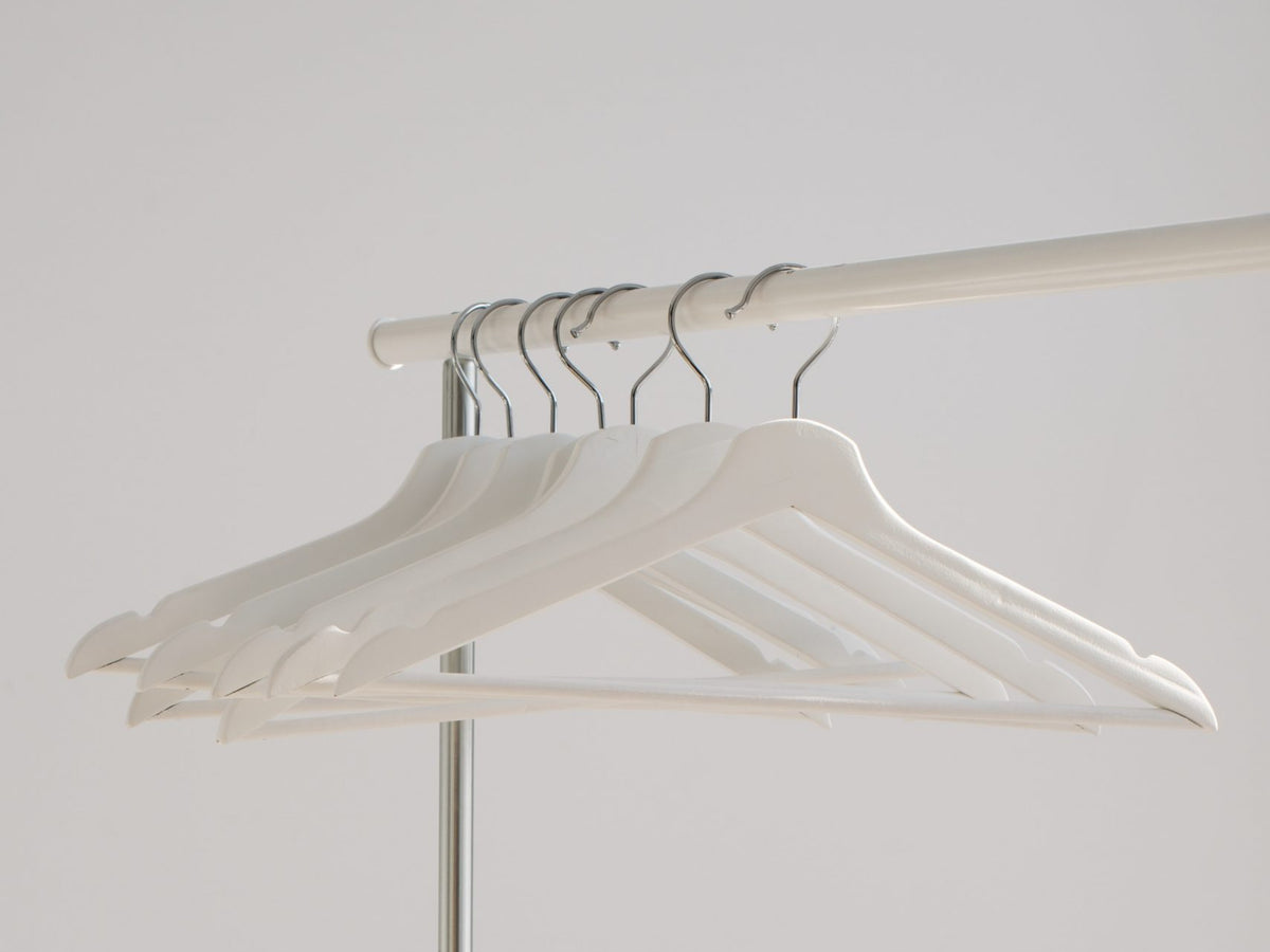 Empty hangers hung on a railing